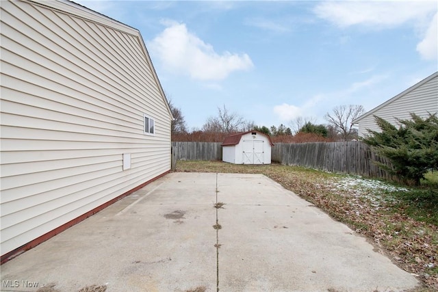 view of patio with a storage shed