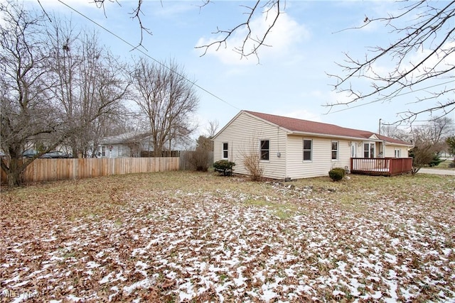 view of side of property with a deck