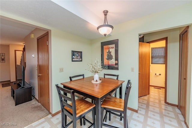 view of carpeted dining space