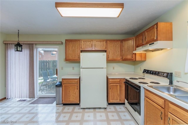 kitchen with hanging light fixtures and white appliances