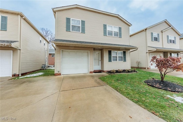 view of front of house with a front yard and a garage