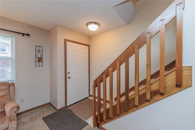 view of carpeted entrance foyer