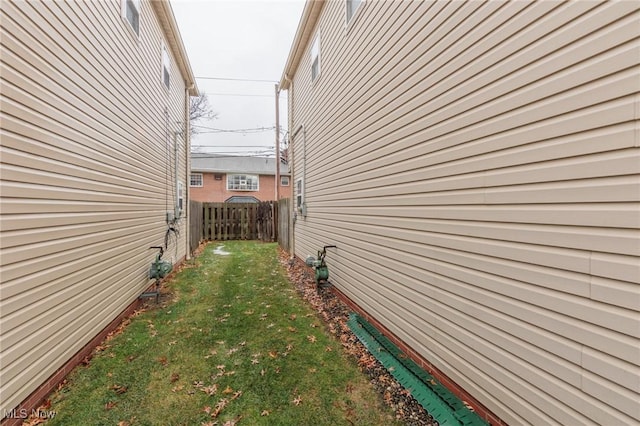 view of home's exterior with a yard