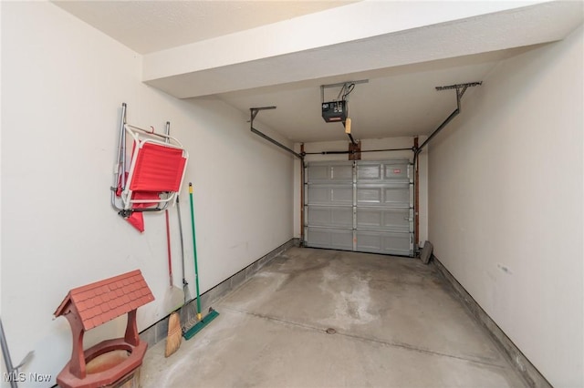 garage featuring a garage door opener