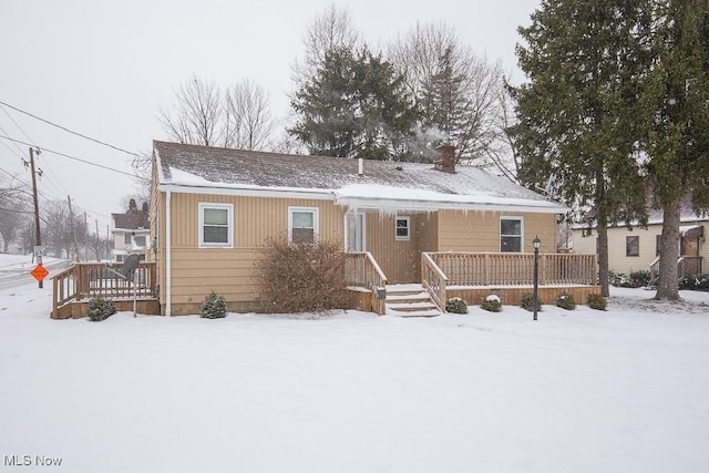 view of snow covered house