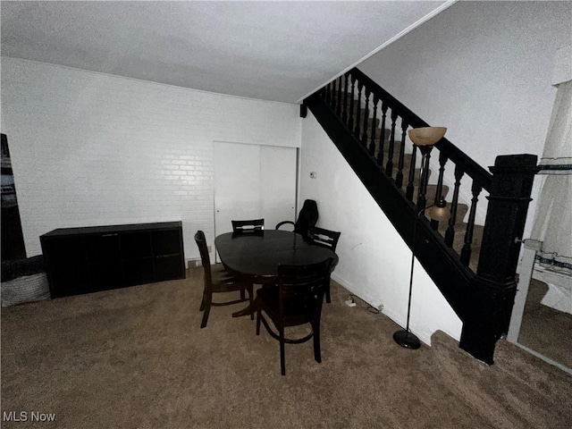 dining area featuring carpet