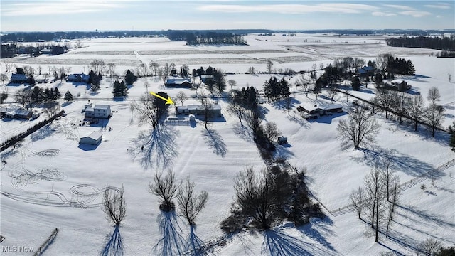 snowy aerial view with a rural view