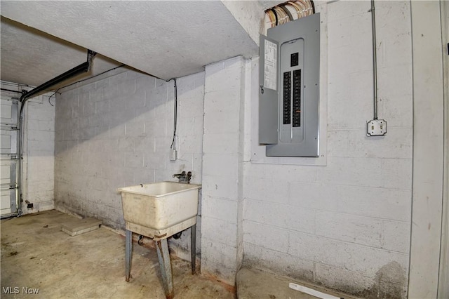 basement with sink and electric panel