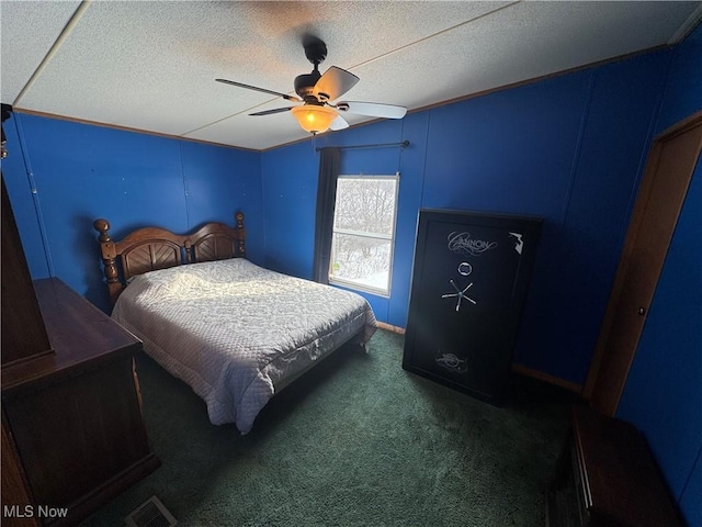 carpeted bedroom featuring ceiling fan, lofted ceiling, and a textured ceiling