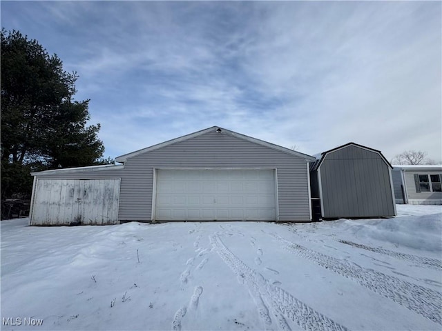 view of snow covered garage