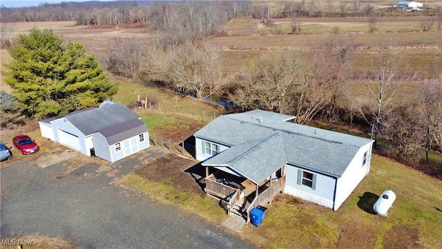 birds eye view of property with a rural view