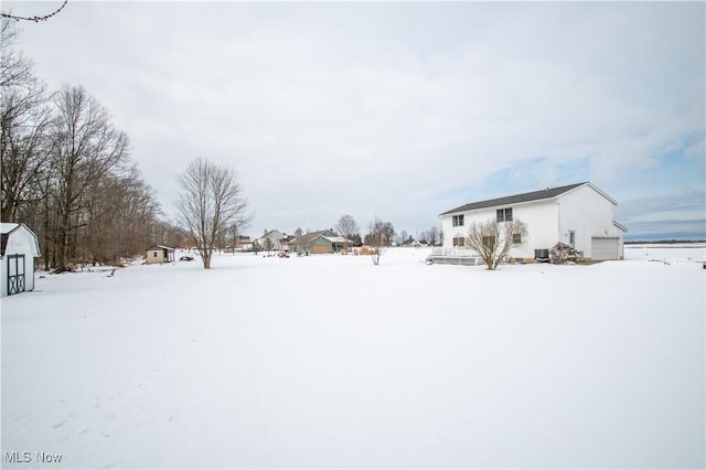 view of yard covered in snow