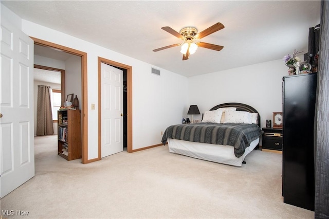 carpeted bedroom featuring ceiling fan