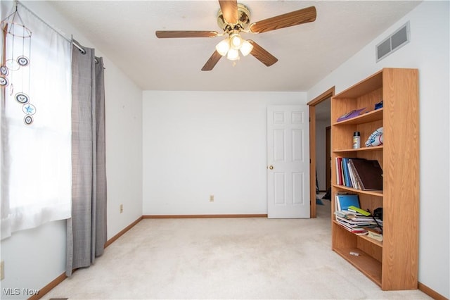 bedroom with light colored carpet and ceiling fan