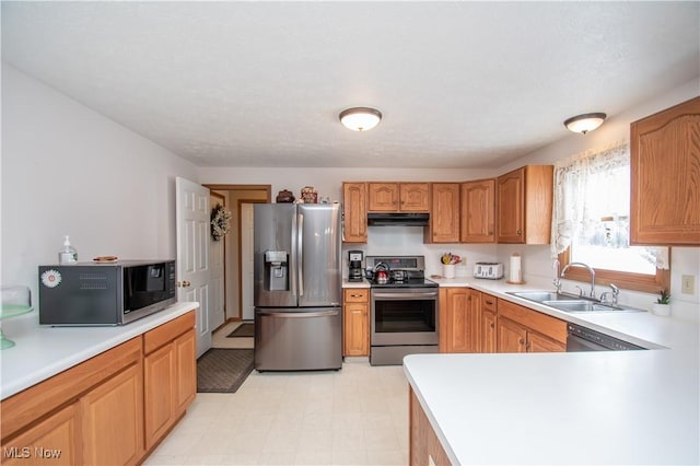 kitchen featuring stainless steel appliances and sink