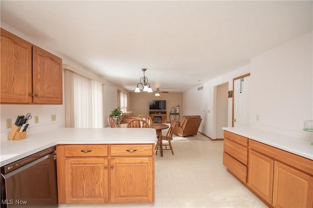 kitchen featuring an inviting chandelier, hanging light fixtures, kitchen peninsula, and dishwasher