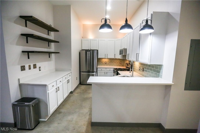 kitchen featuring hanging light fixtures, stainless steel appliances, electric panel, white cabinets, and kitchen peninsula