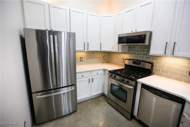 kitchen with white cabinetry, appliances with stainless steel finishes, and backsplash