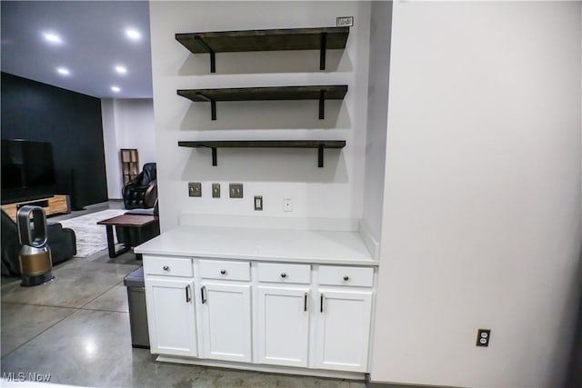 bar featuring white cabinetry