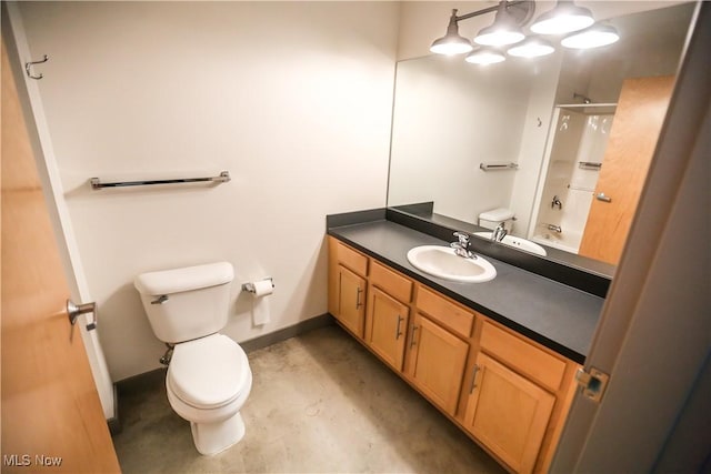 full bathroom with concrete flooring, vanity, washtub / shower combination, and toilet