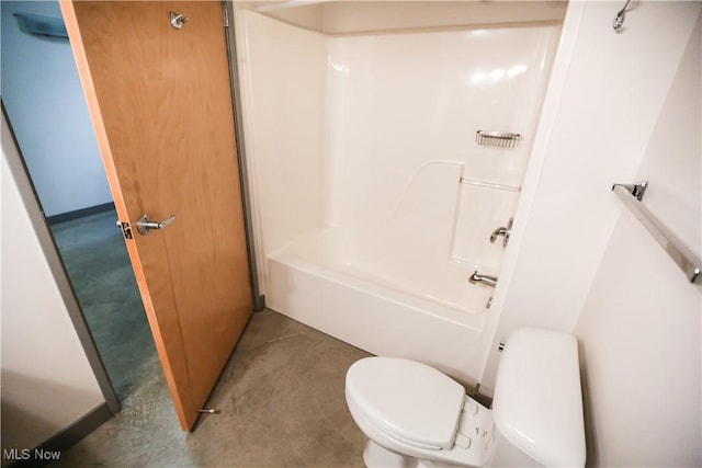 bathroom with bathtub / shower combination and toilet