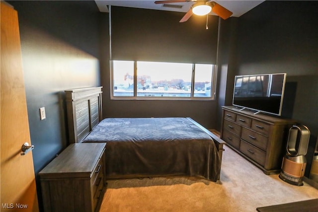 bedroom featuring ceiling fan and light colored carpet