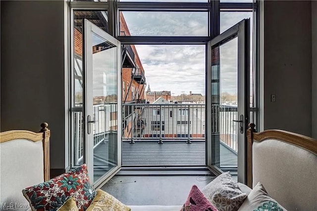 entryway with floor to ceiling windows and a healthy amount of sunlight