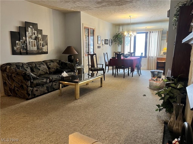 carpeted living room with a textured ceiling and a notable chandelier