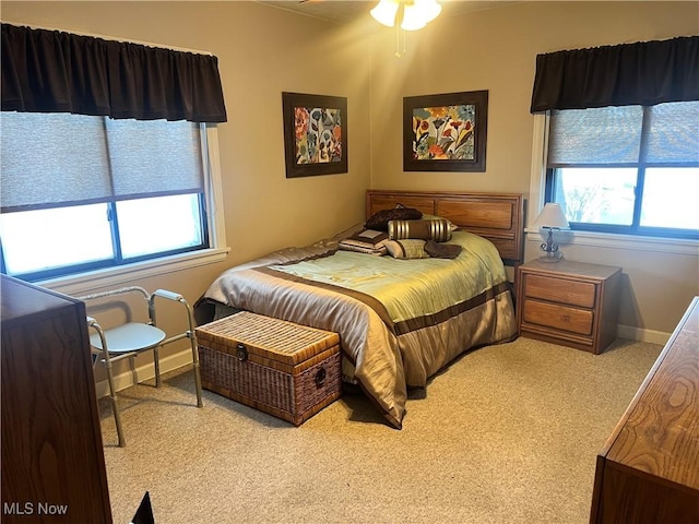 bedroom featuring light colored carpet