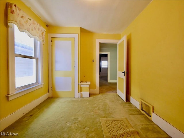 spare room with light carpet