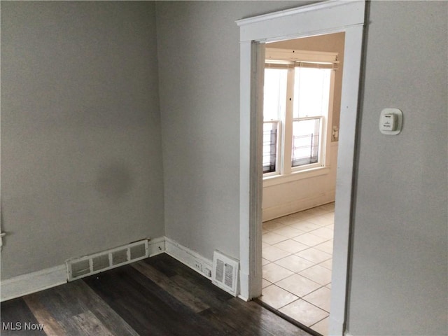 empty room with hardwood / wood-style floors