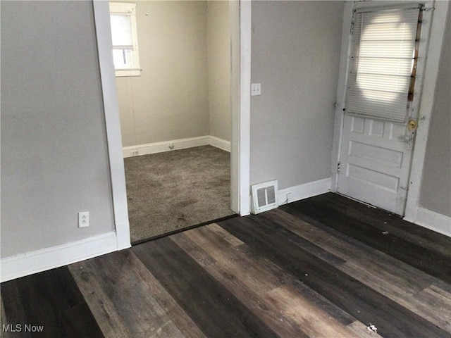 foyer entrance with dark hardwood / wood-style floors