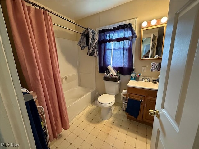 full bathroom featuring toilet, shower / bath combo, and vanity