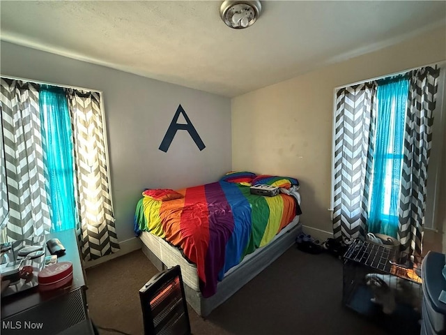 bedroom featuring multiple windows