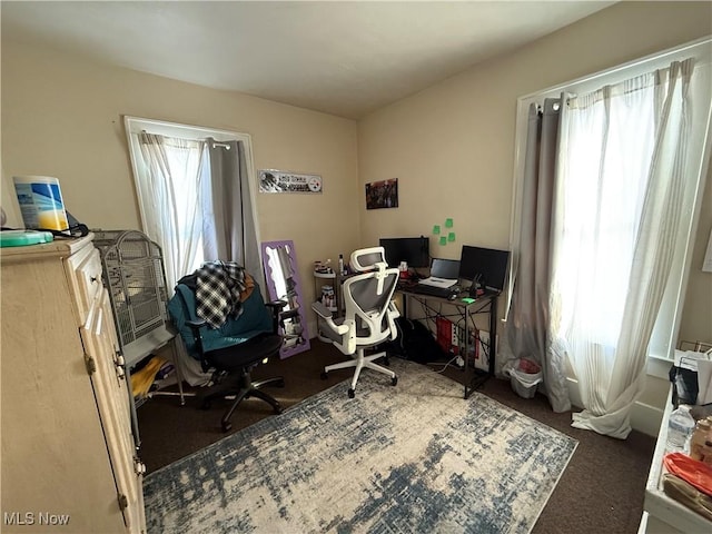 office area with dark colored carpet