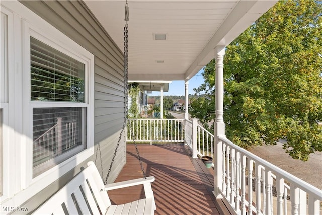 wooden terrace with a porch