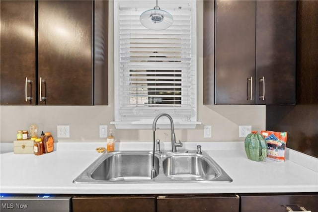 kitchen featuring sink, dark brown cabinetry, and dishwasher