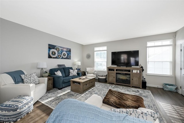 living room featuring light hardwood / wood-style flooring and a healthy amount of sunlight