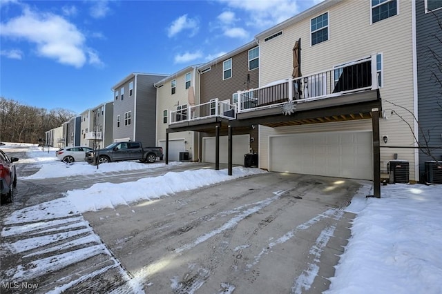 exterior space featuring a garage and central air condition unit