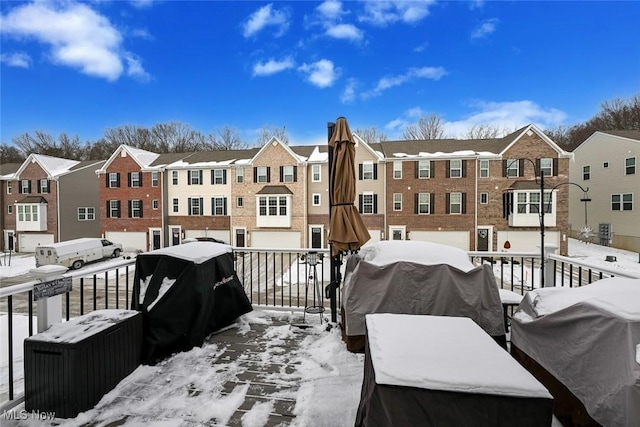 snow covered deck with area for grilling