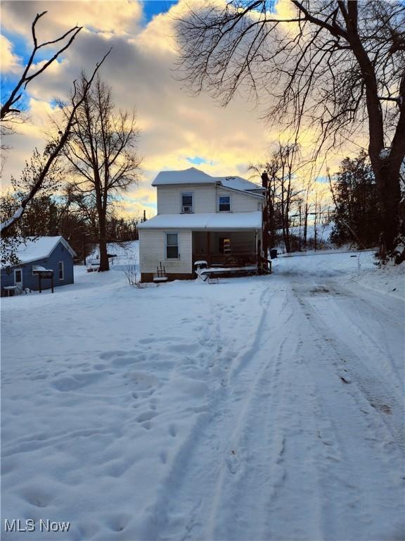 view of snow covered property