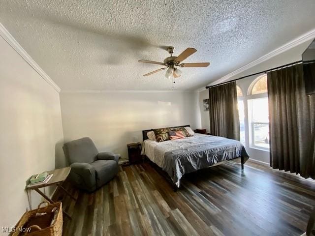 bedroom featuring ceiling fan, dark hardwood / wood-style floors, crown molding, and a textured ceiling