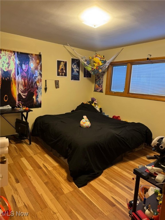 bedroom featuring light wood-type flooring