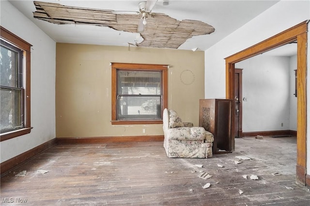 unfurnished room featuring ceiling fan, hardwood / wood-style floors, and plenty of natural light