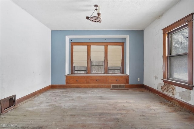 unfurnished room featuring light wood-type flooring