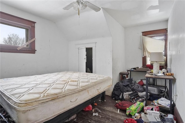 bedroom with hardwood / wood-style floors, vaulted ceiling, and ceiling fan