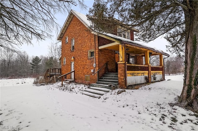 view of snow covered house