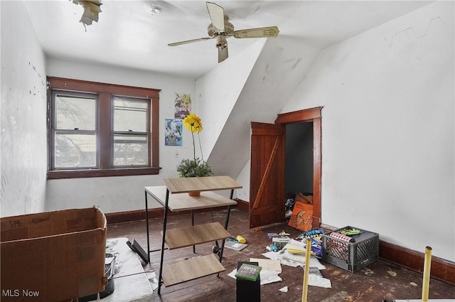 miscellaneous room featuring vaulted ceiling and ceiling fan