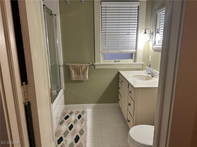 full bathroom with toilet, tile patterned floors, tub / shower combination, and vanity