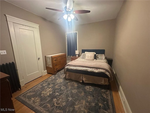 bedroom featuring ceiling fan and wood-type flooring